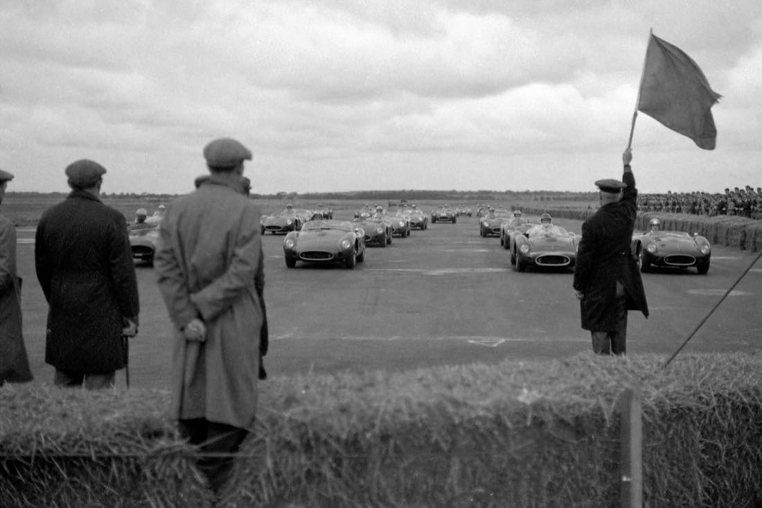Sports racing cars on the start line of an airfield circuit